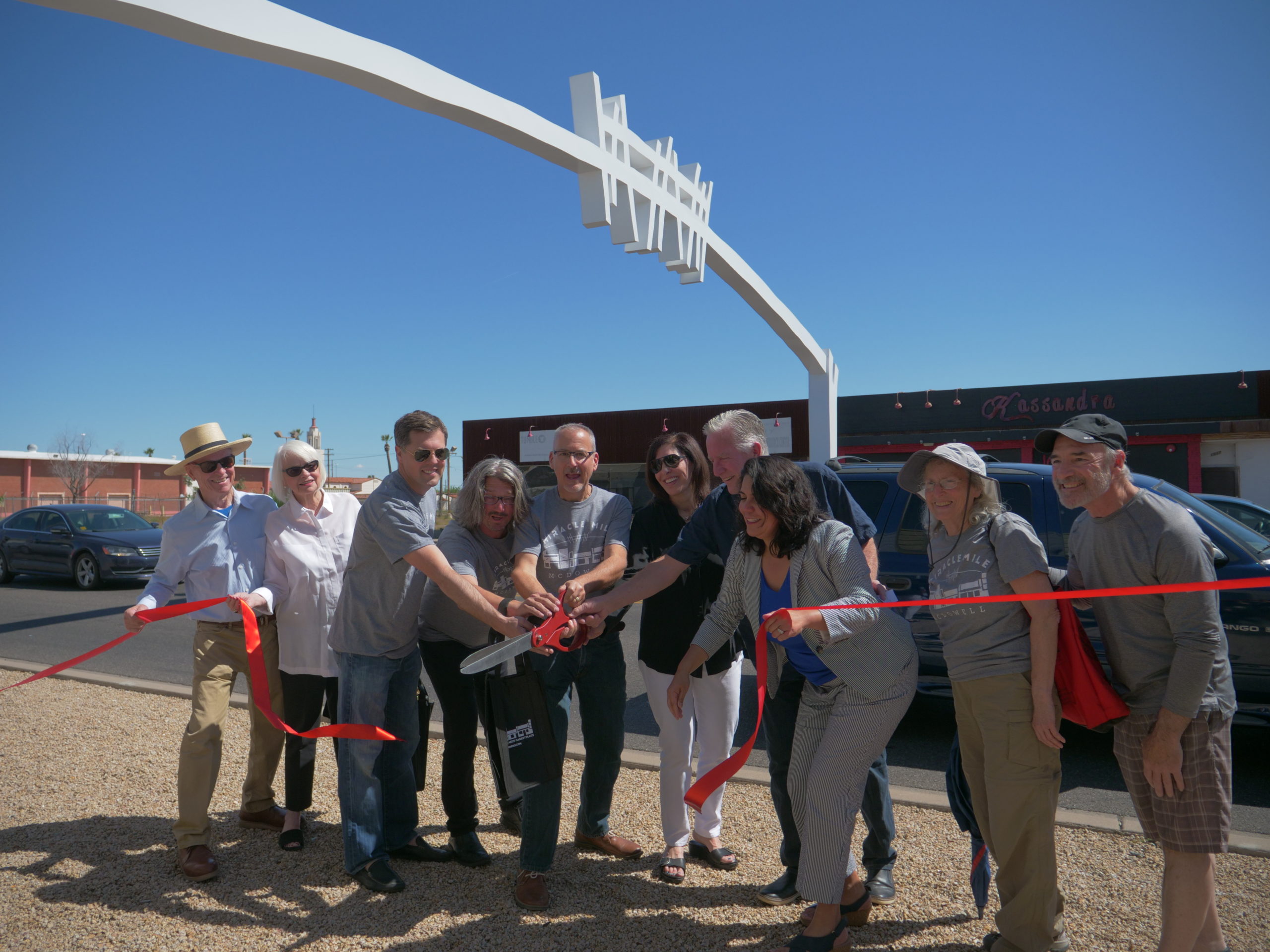 The McDowell Gateway Arch is rededicated.  From left to right: Joan Armstrong & Joan Armstrong, Armstrong Prior Gallery; Josh Tinkle, Administrator Banner University Medical Center Phoenix,; Michael Kelly, Miracle Mile Commercial Corridor Coordinator Trellis; Joel McCabe, COO Trellis, Michelle Stuhl, McDowell Gateway Artist; Michael Anderson, McDowell Gateway Artist, Councilwoman Laura Pastor, District 4 Phoenix; Dr. Donna Reiner, Friends of Phoenix Public Art; Mike Oleskow, Curator Found:RE.